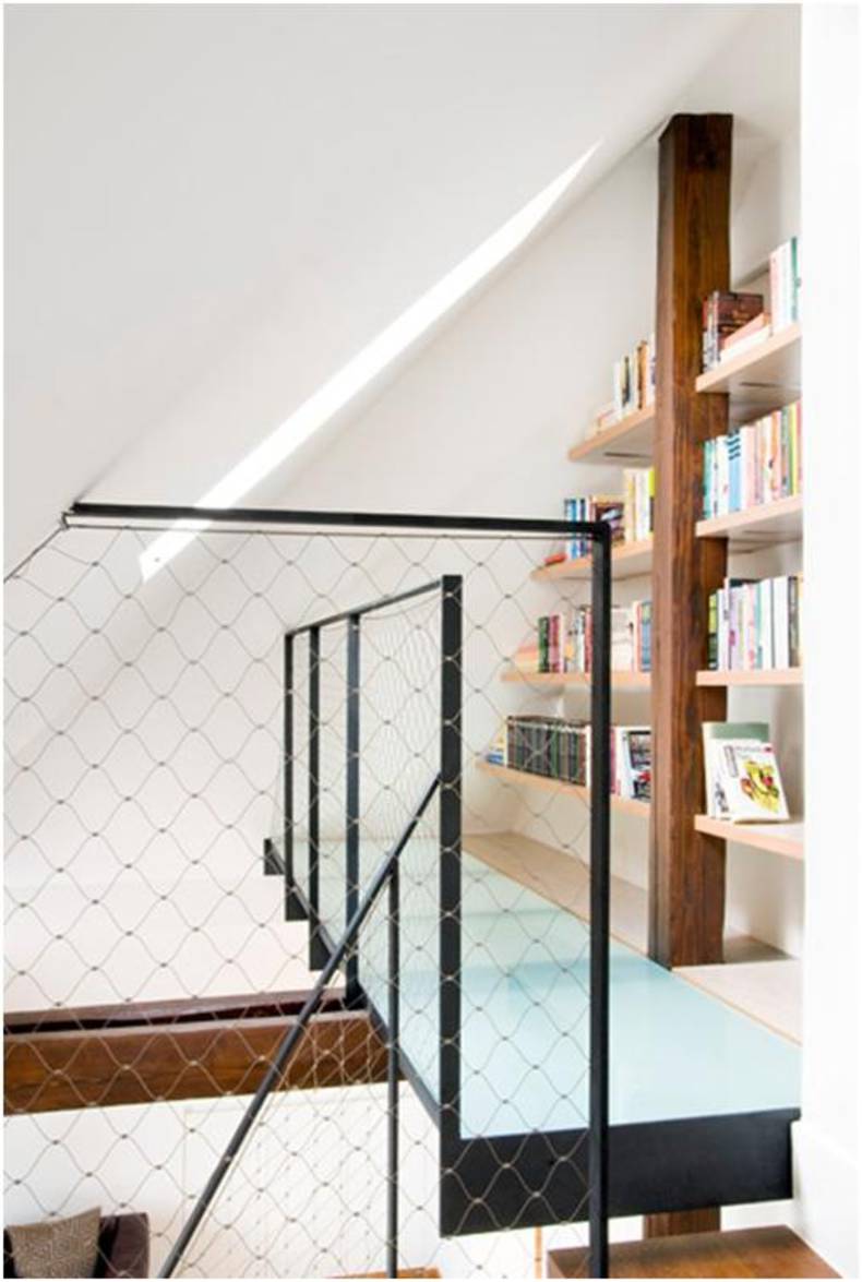 Compact bookshelves built into the staircase