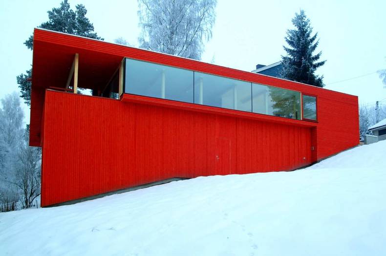 Wooden House with Red Facade by JVA Architects